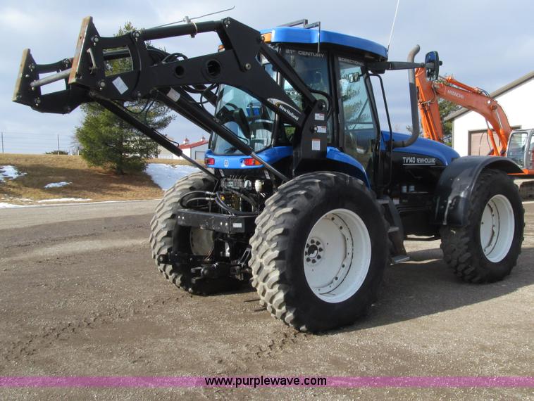 image for item E4647 2002 New Holland TV-140 bi-directional MFWD  tractor
