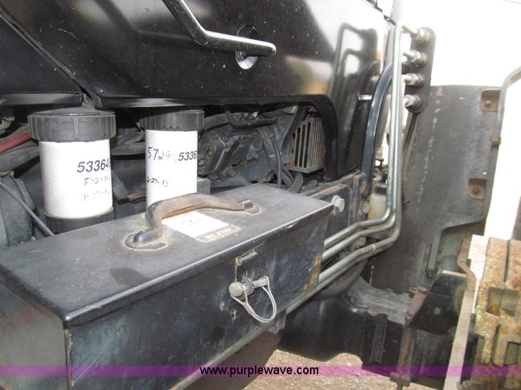 image for item E4647 2002 New Holland TV-140 bi-directional MFWD  tractor