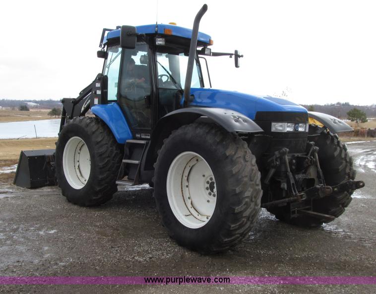 image for item E4647 2002 New Holland TV-140 bi-directional MFWD  tractor