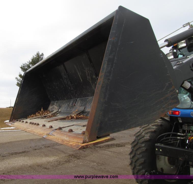 image for item E4647 2002 New Holland TV-140 bi-directional MFWD  tractor