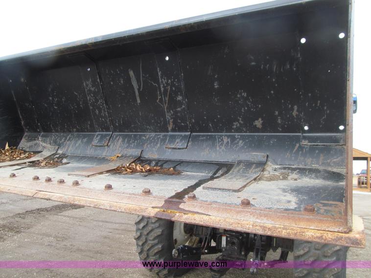 image for item E4647 2002 New Holland TV-140 bi-directional MFWD  tractor