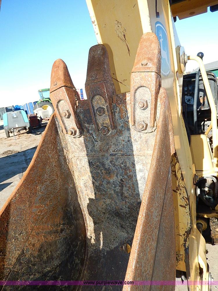 image for item H1272 2006 John Deere 110 backhoe