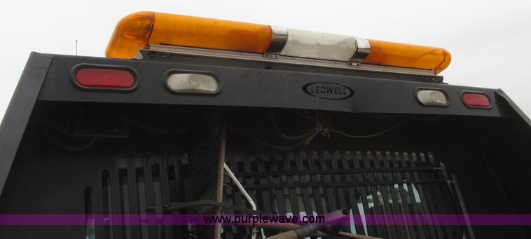 image for item G2253 2006 Freightliner Business Class M2 rollback truck