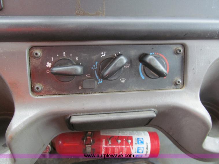 image for item G9554 2006 Freightliner Business Class M2 rollback truck