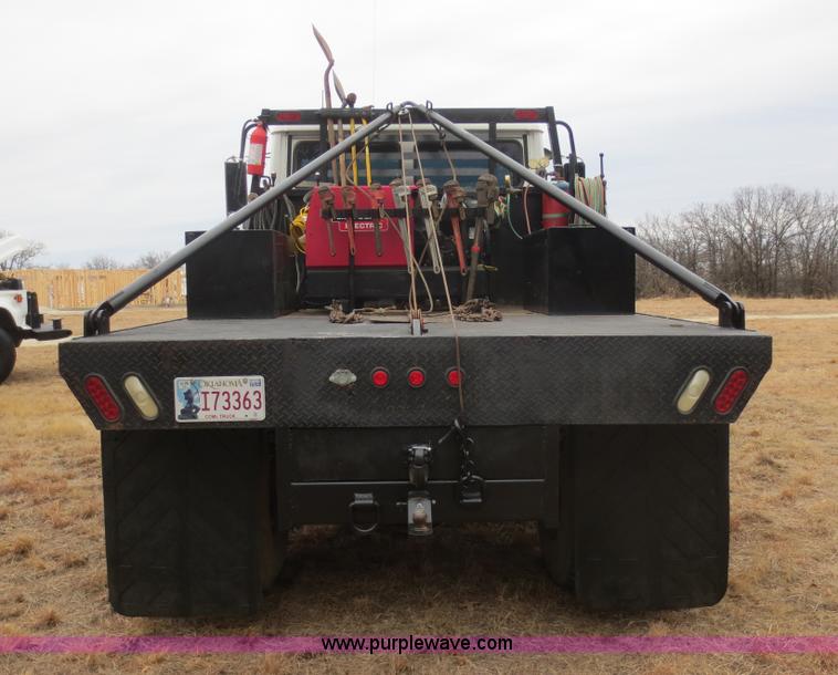 image for item F8139 1999 Freightliner FL80 winch truck