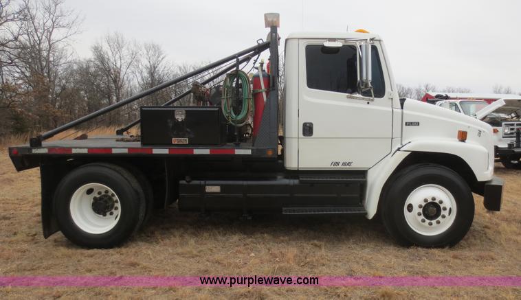 image for item F8139 1999 Freightliner FL80 winch truck