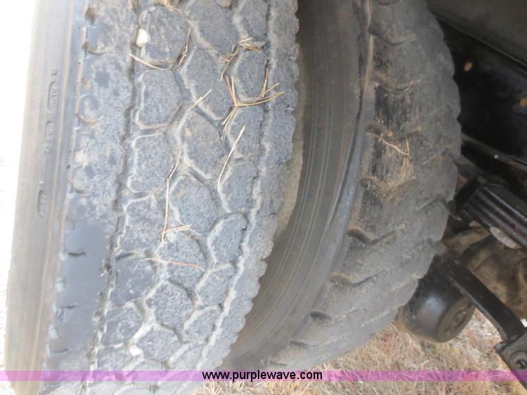 image for item F8139 1999 Freightliner FL80 winch truck