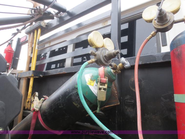 image for item F8139 1999 Freightliner FL80 winch truck