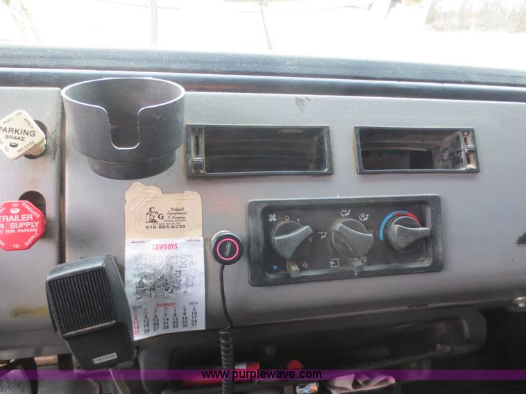 image for item F8139 1999 Freightliner FL80 winch truck