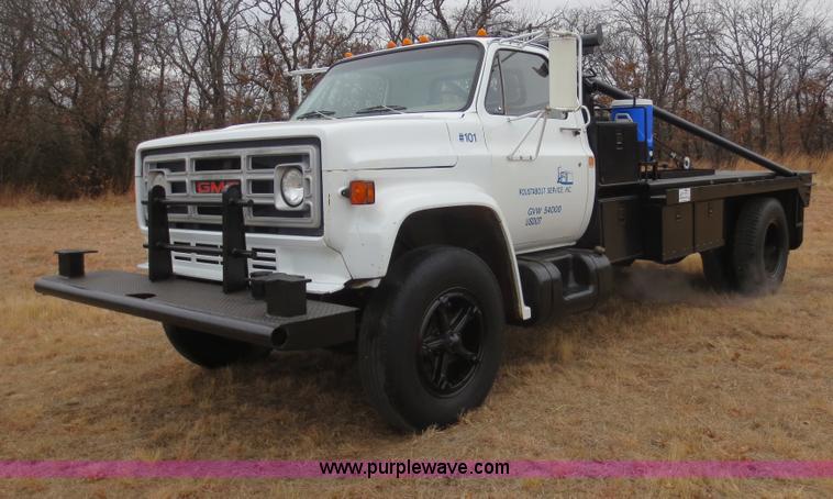 image for item F8140 1984 GMC TopKick winch truck