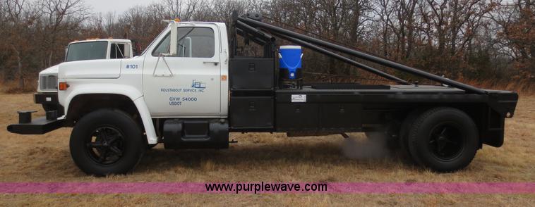 image for item F8140 1984 GMC TopKick winch truck