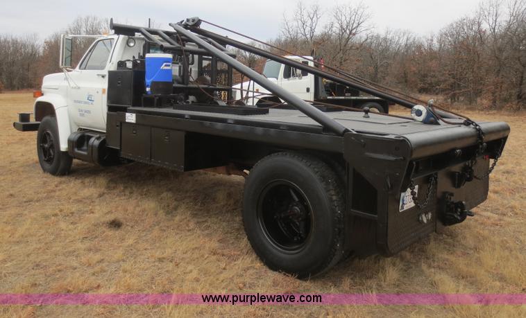 image for item F8140 1984 GMC TopKick winch truck