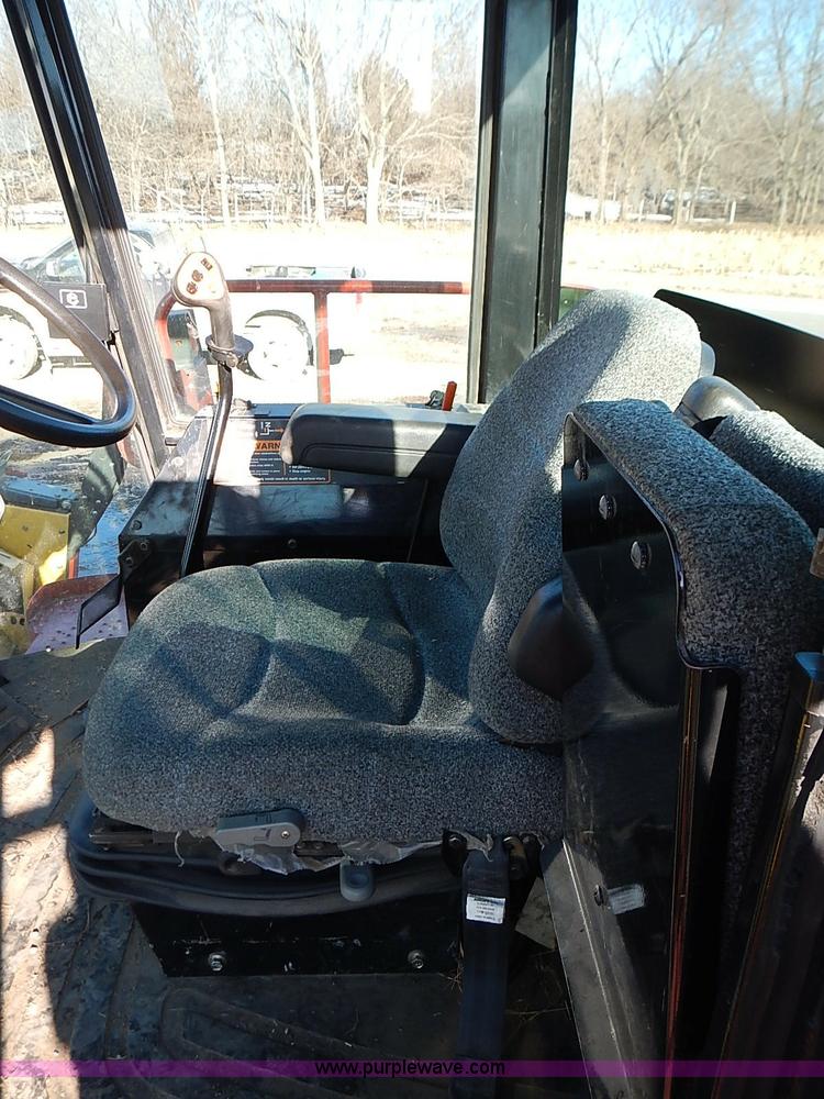 image for item I9407 2005 New Holland HW305 self-propelled windrower