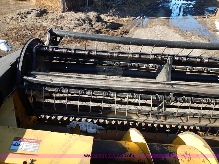 image for item I9407 2005 New Holland HW305 self-propelled windrower