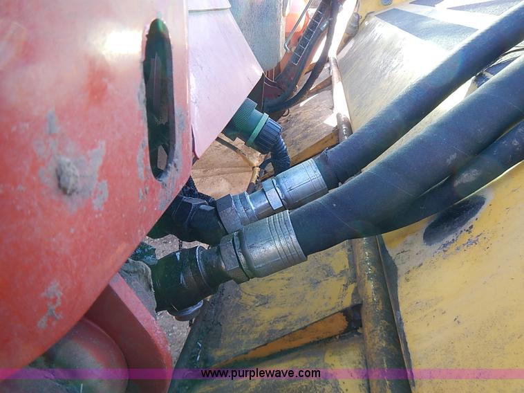 image for item I9407 2005 New Holland HW305 self-propelled windrower