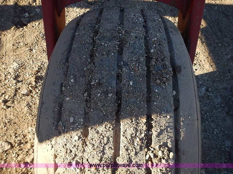 image for item I9407 2005 New Holland HW305 self-propelled windrower