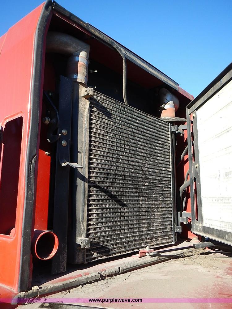 image for item I9407 2005 New Holland HW305 self-propelled windrower