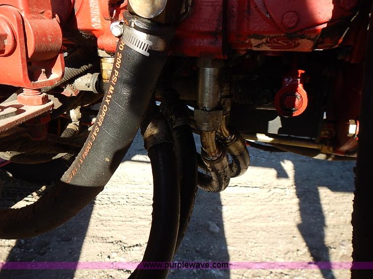 image for item I9407 2005 New Holland HW305 self-propelled windrower