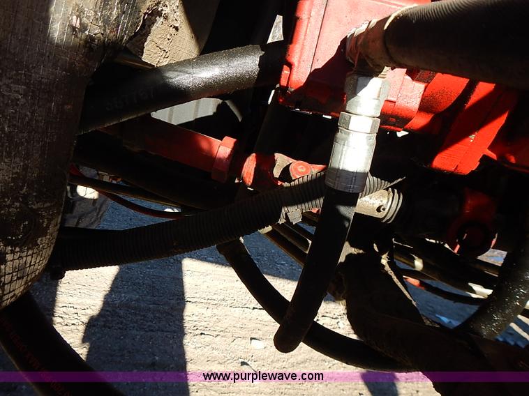 image for item I9407 2005 New Holland HW305 self-propelled windrower