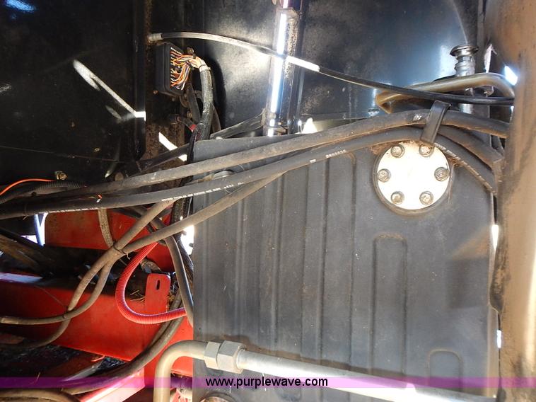 image for item I9407 2005 New Holland HW305 self-propelled windrower