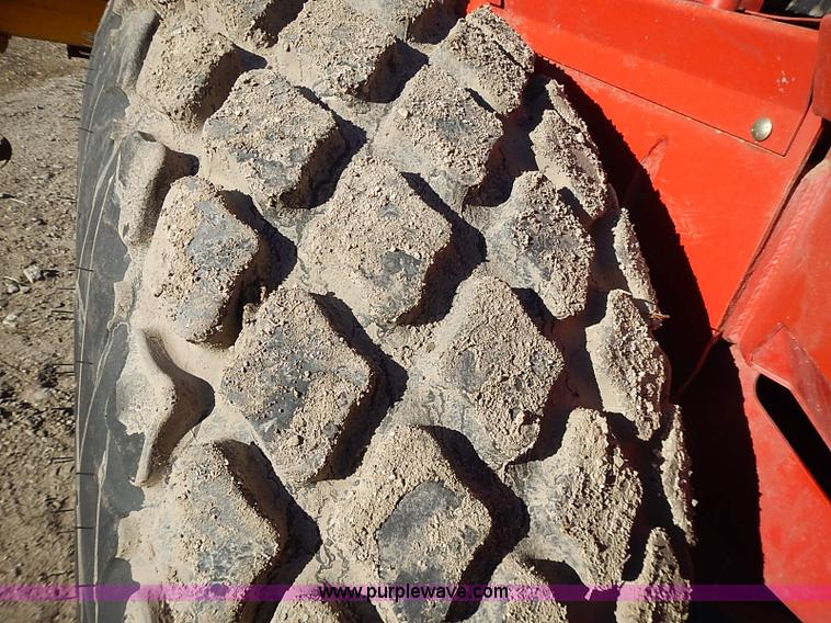 image for item I9407 2005 New Holland HW305 self-propelled windrower