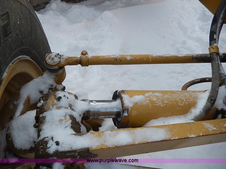 image for item H1314 1999 Caterpillar 140H articulated motor grader
