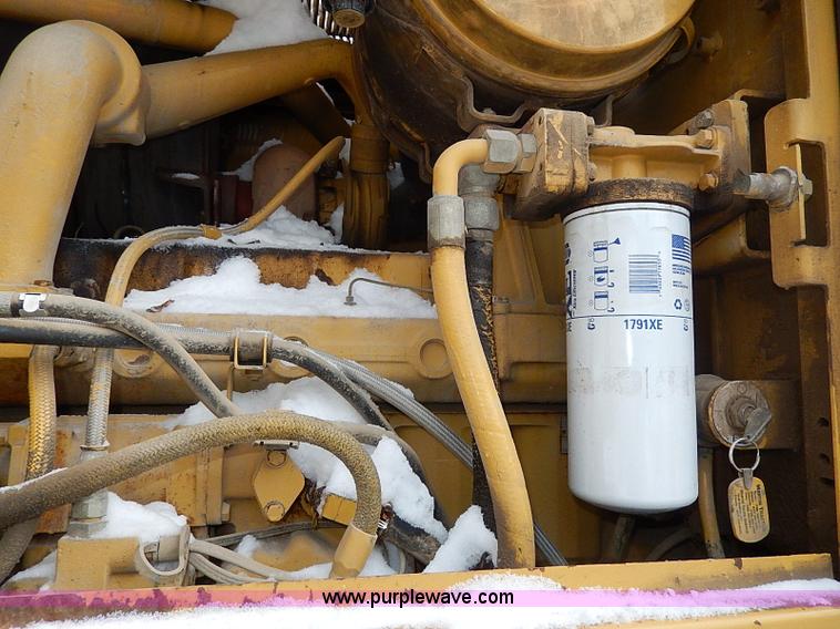 image for item H1314 1999 Caterpillar 140H articulated motor grader