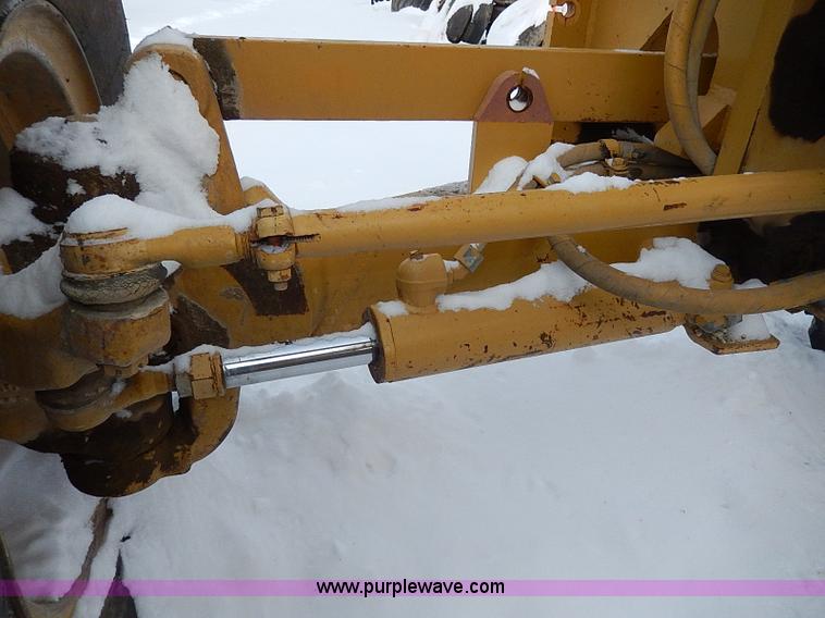 image for item H1314 1999 Caterpillar 140H articulated motor grader