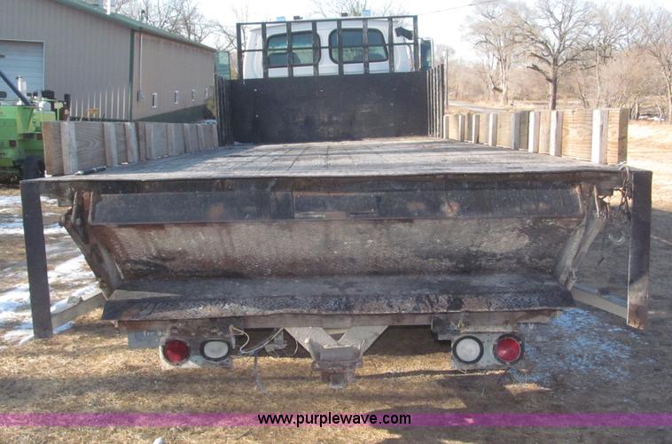 image for item F7252 1997 Ford L8501 Louisville 20' flatbed truck with lift gate