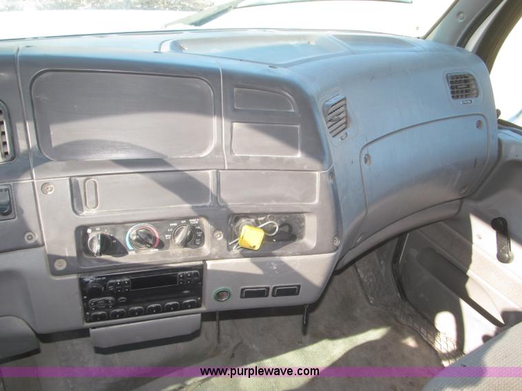 image for item F7252 1997 Ford L8501 Louisville 20' flatbed truck with lift gate