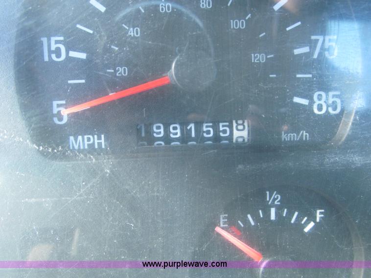 image for item F7252 1997 Ford L8501 Louisville 20' flatbed truck with lift gate