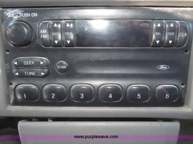 image for item F7252 1997 Ford L8501 Louisville 20' flatbed truck with lift gate