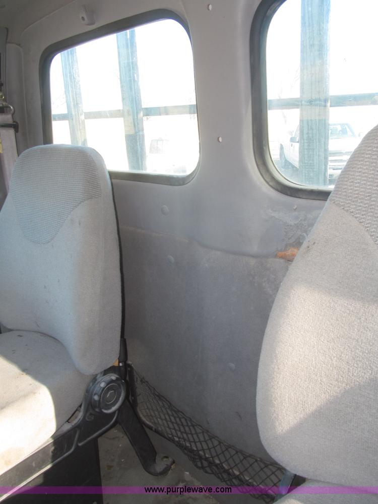 image for item F7252 1997 Ford L8501 Louisville 20' flatbed truck with lift gate