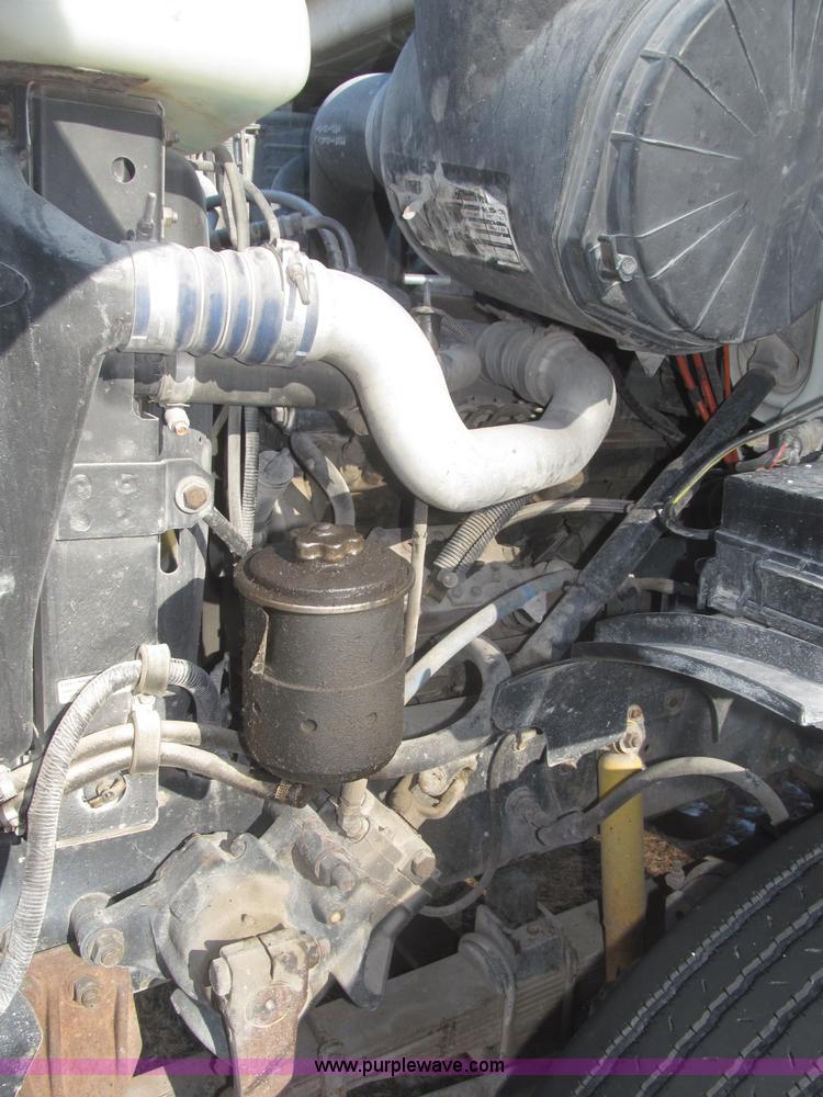 image for item F7252 1997 Ford L8501 Louisville 20' flatbed truck with lift gate