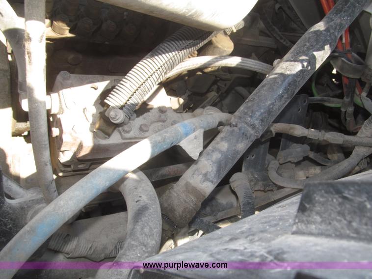 image for item F7252 1997 Ford L8501 Louisville 20' flatbed truck with lift gate