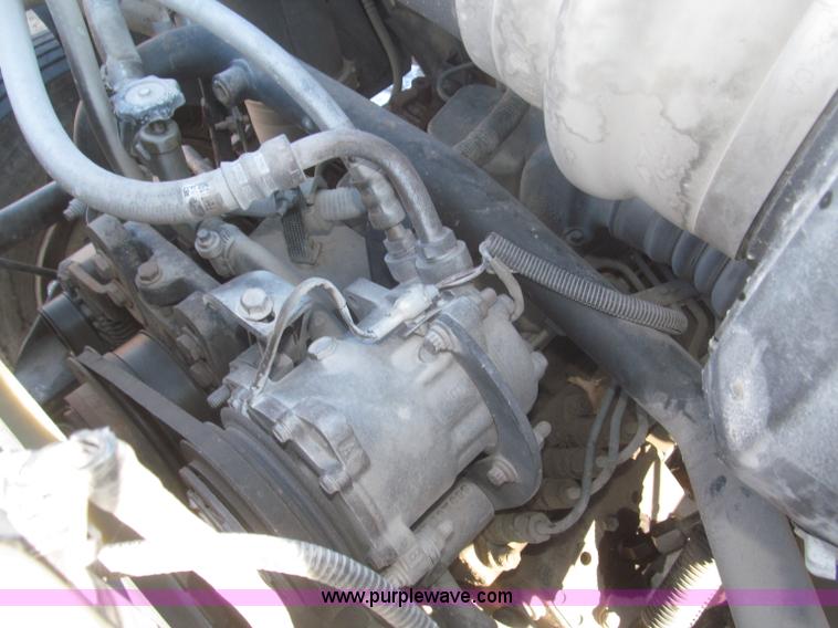 image for item F7252 1997 Ford L8501 Louisville 20' flatbed truck with lift gate