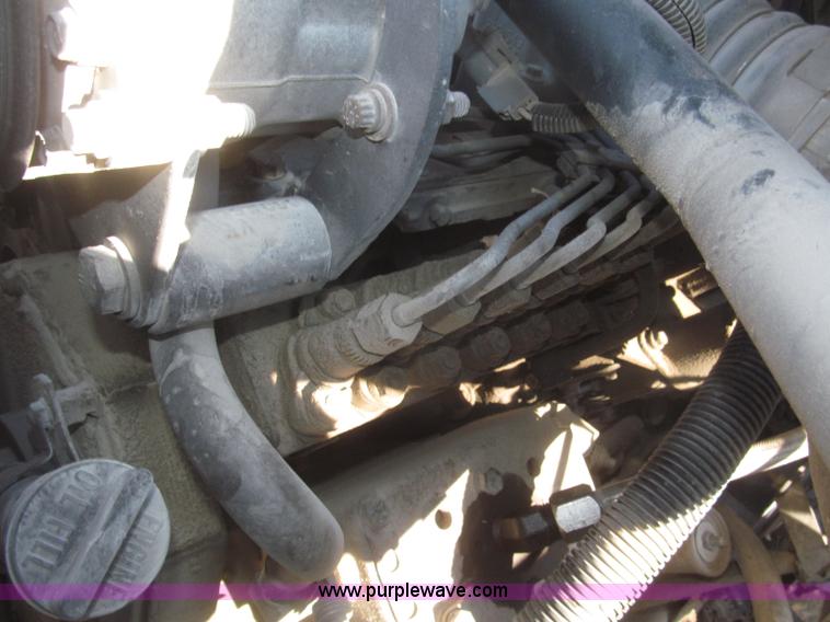 image for item F7252 1997 Ford L8501 Louisville 20' flatbed truck with lift gate