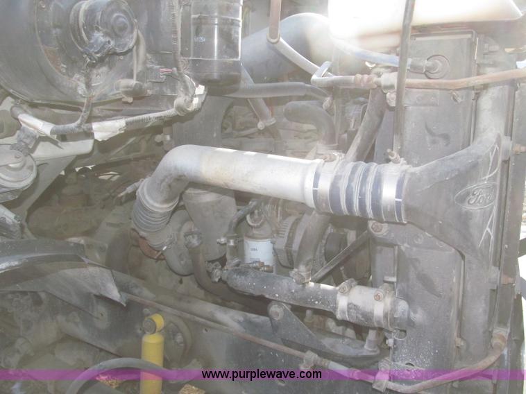 image for item F7252 1997 Ford L8501 Louisville 20' flatbed truck with lift gate