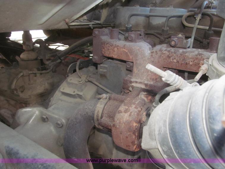 image for item F7252 1997 Ford L8501 Louisville 20' flatbed truck with lift gate