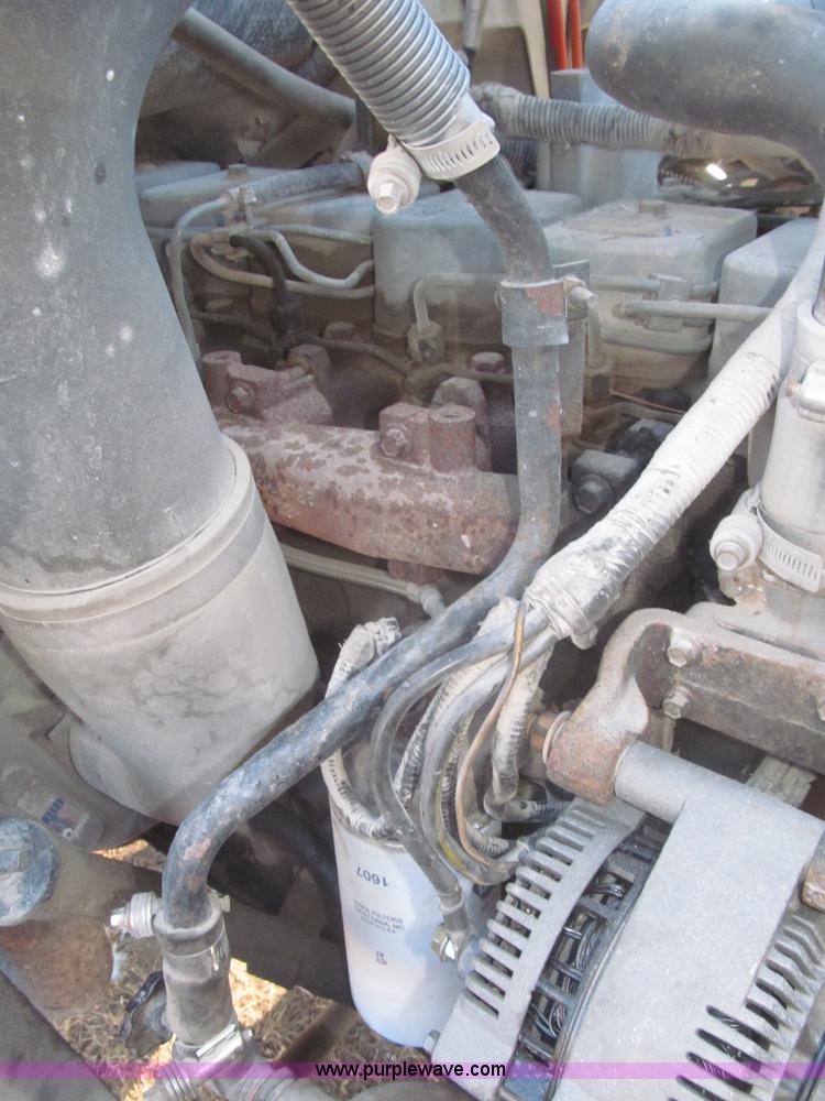 image for item F7252 1997 Ford L8501 Louisville 20' flatbed truck with lift gate