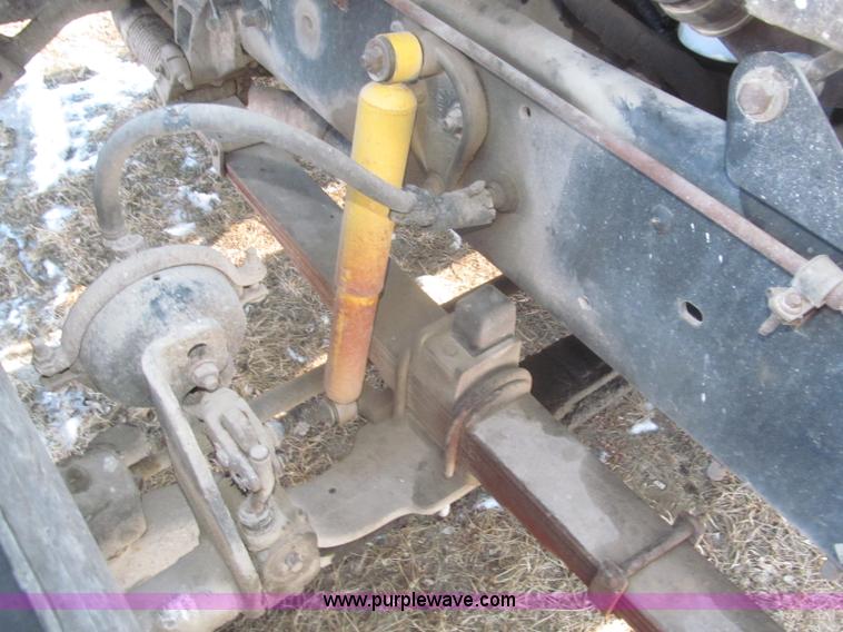 image for item F7252 1997 Ford L8501 Louisville 20' flatbed truck with lift gate