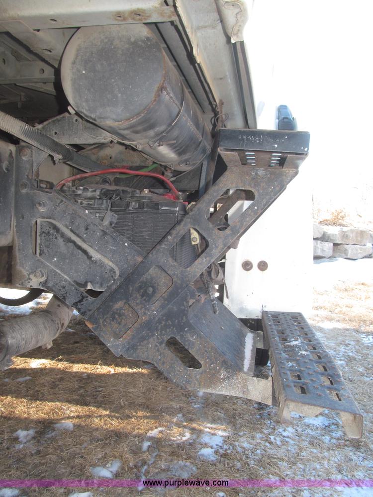 image for item F7252 1997 Ford L8501 Louisville 20' flatbed truck with lift gate