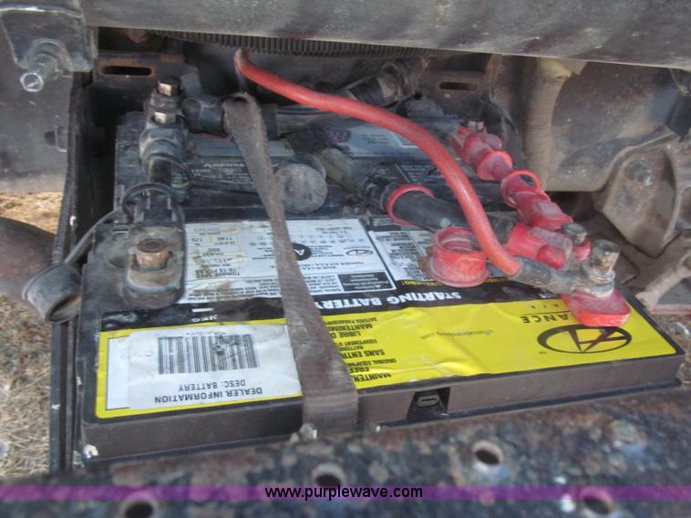 image for item F7252 1997 Ford L8501 Louisville 20' flatbed truck with lift gate