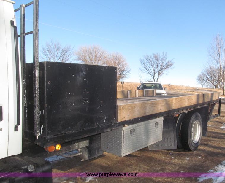 image for item F7252 1997 Ford L8501 Louisville 20' flatbed truck with lift gate