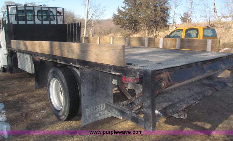 image for item F7252 1997 Ford L8501 Louisville 20' flatbed truck with lift gate