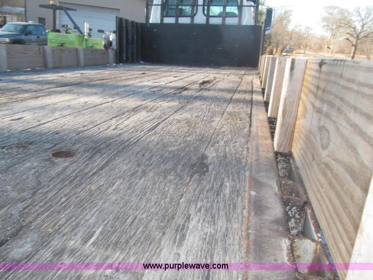 image for item F7252 1997 Ford L8501 Louisville 20' flatbed truck with lift gate