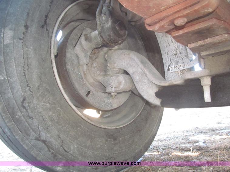 image for item F7252 1997 Ford L8501 Louisville 20' flatbed truck with lift gate