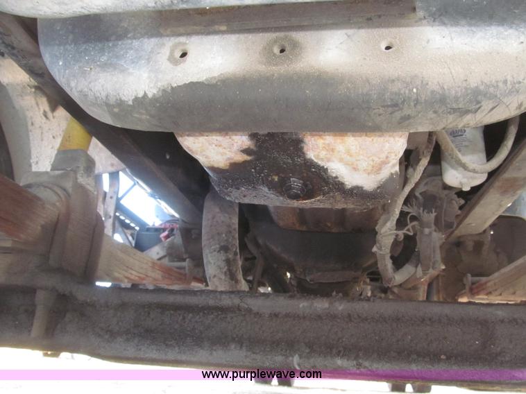 image for item F7252 1997 Ford L8501 Louisville 20' flatbed truck with lift gate