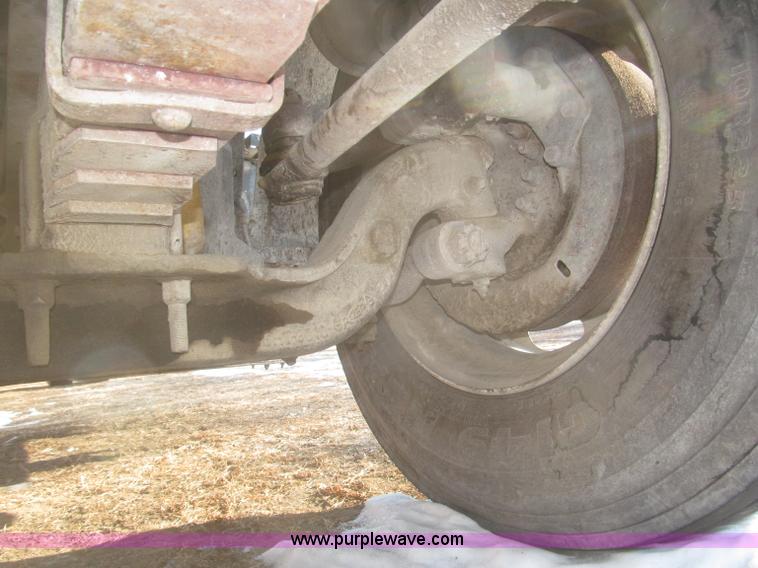 image for item F7252 1997 Ford L8501 Louisville 20' flatbed truck with lift gate