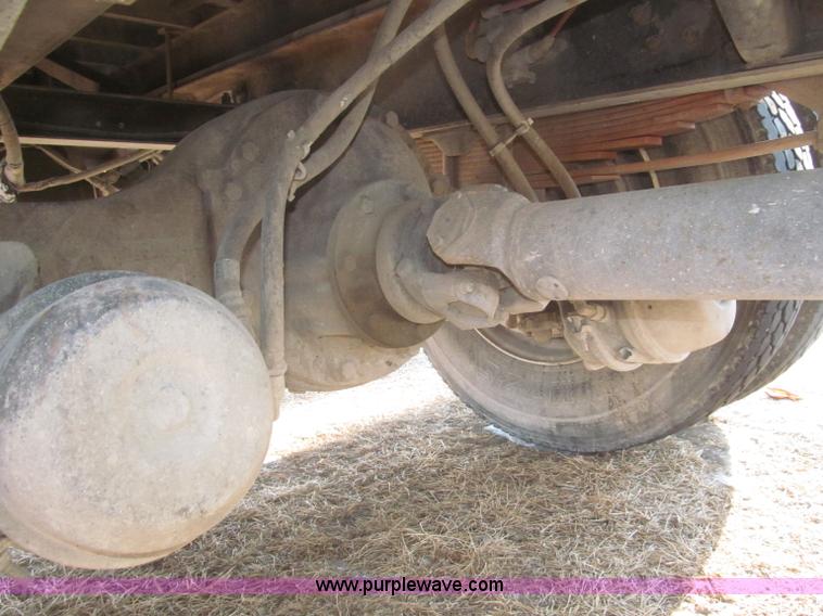 image for item F7252 1997 Ford L8501 Louisville 20' flatbed truck with lift gate